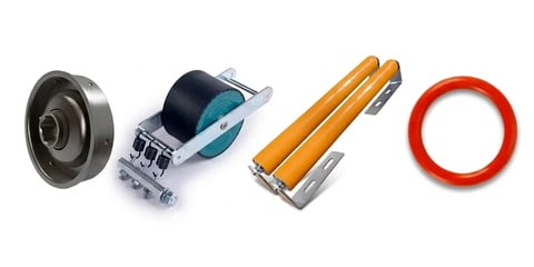 Four warehouse and packing supplies: metal pulley wheel, tape dispenser, yellow paint markers, and red rubber band